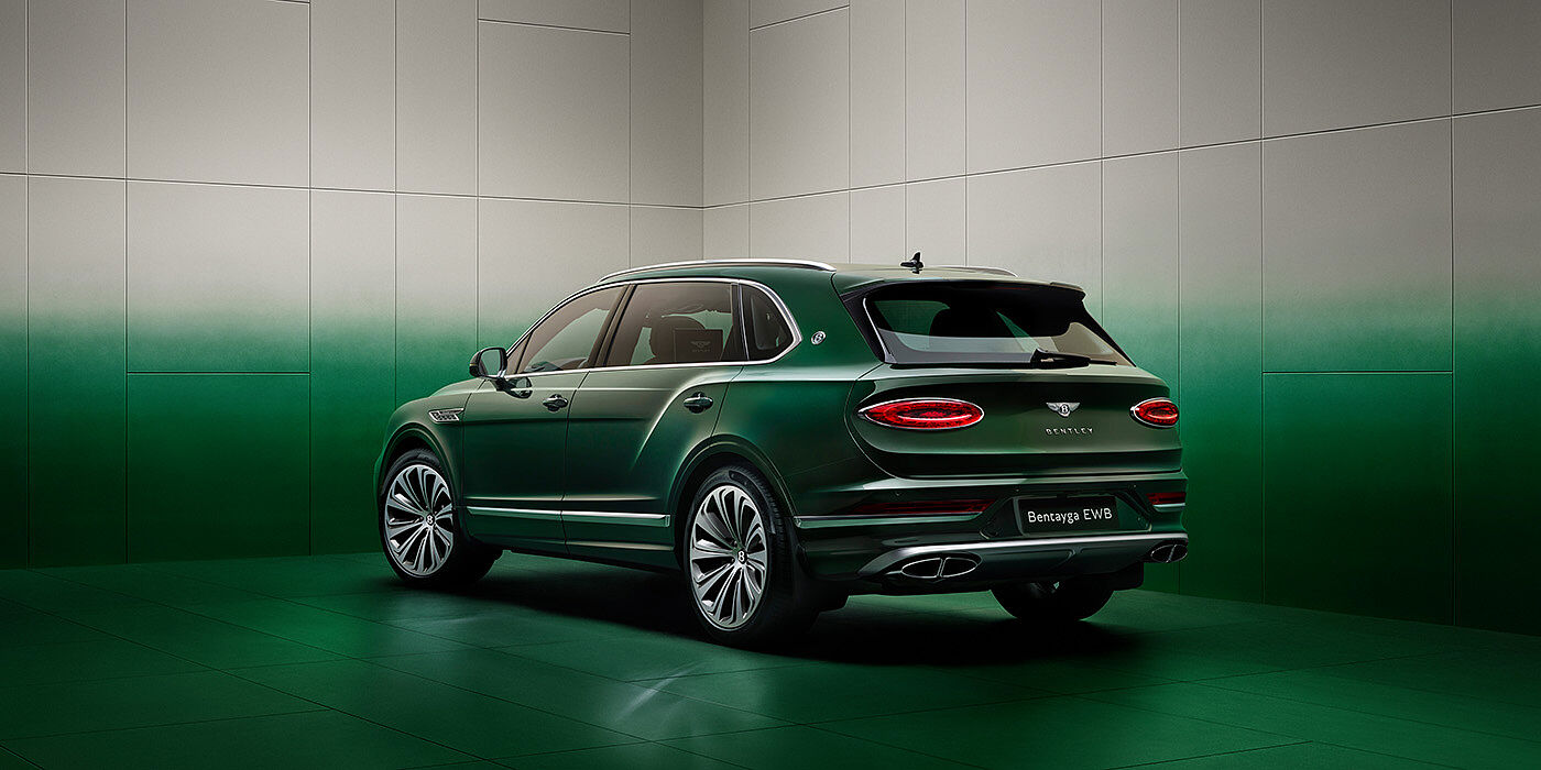 Bentley Bordeaux Bentley Bentayga Extended Wheelbase SUV Rear three quarter view in Light Emerald green paint in green and grey room