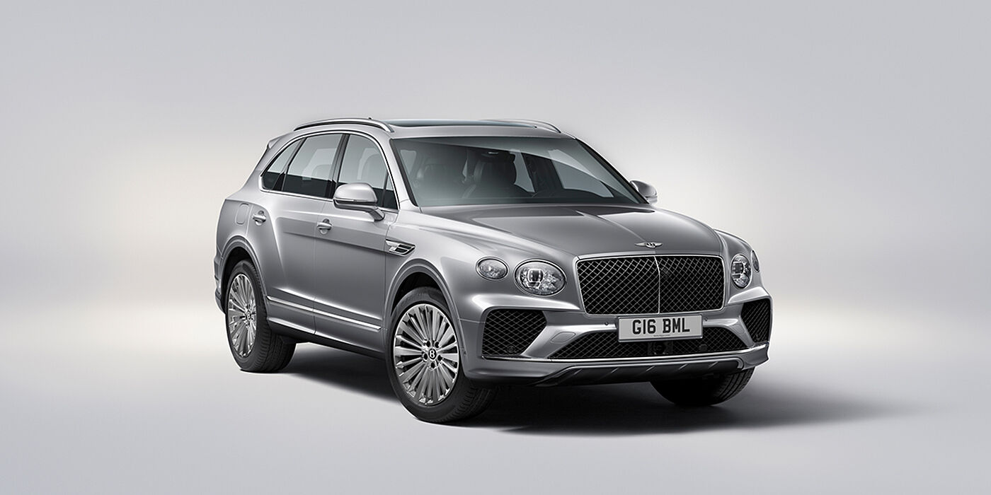Bentley Bordeaux Bentley Bentayga luxury SUV front three quarter view in Moonbeam paint with matrix grille and 21″ 5 spoke painted wheels