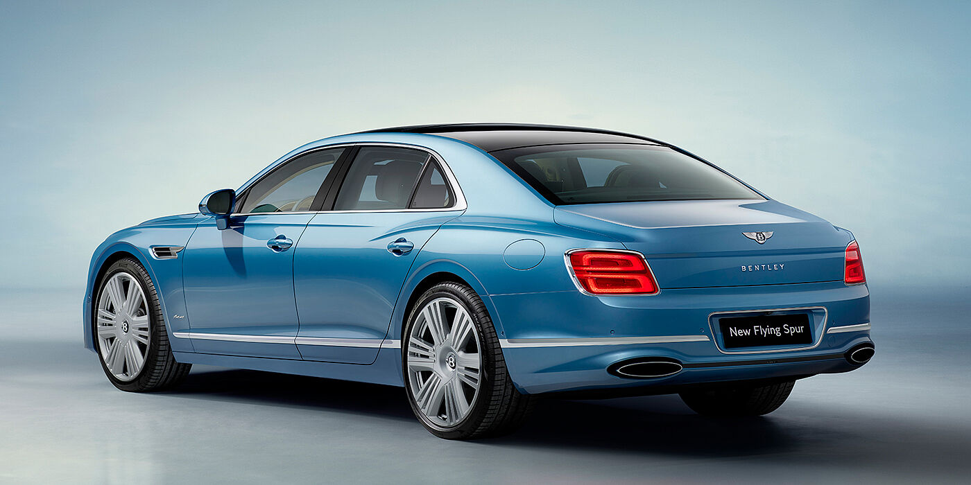 Bentley Bordeaux New Bentley Flying Spur Azure sedan rear view in Light windsor blue by Mulliner paint with 22 inch Azure wheels and chrome exterior details