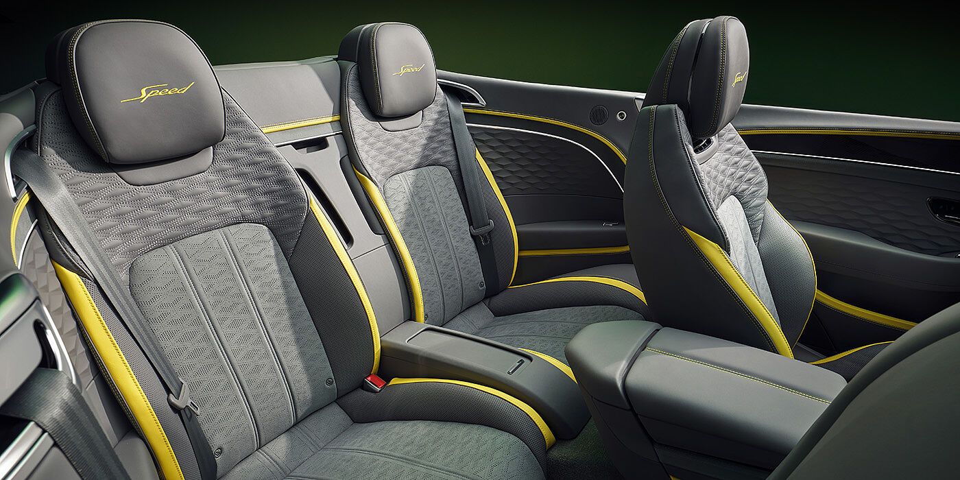 Bentley Bordeaux Bentley New Continental GTC Speed convertible rear interior with unique Speed colour split in Gravity Grey and Cyber Yellow hide colours, and contrast stitched headrest emblems 
