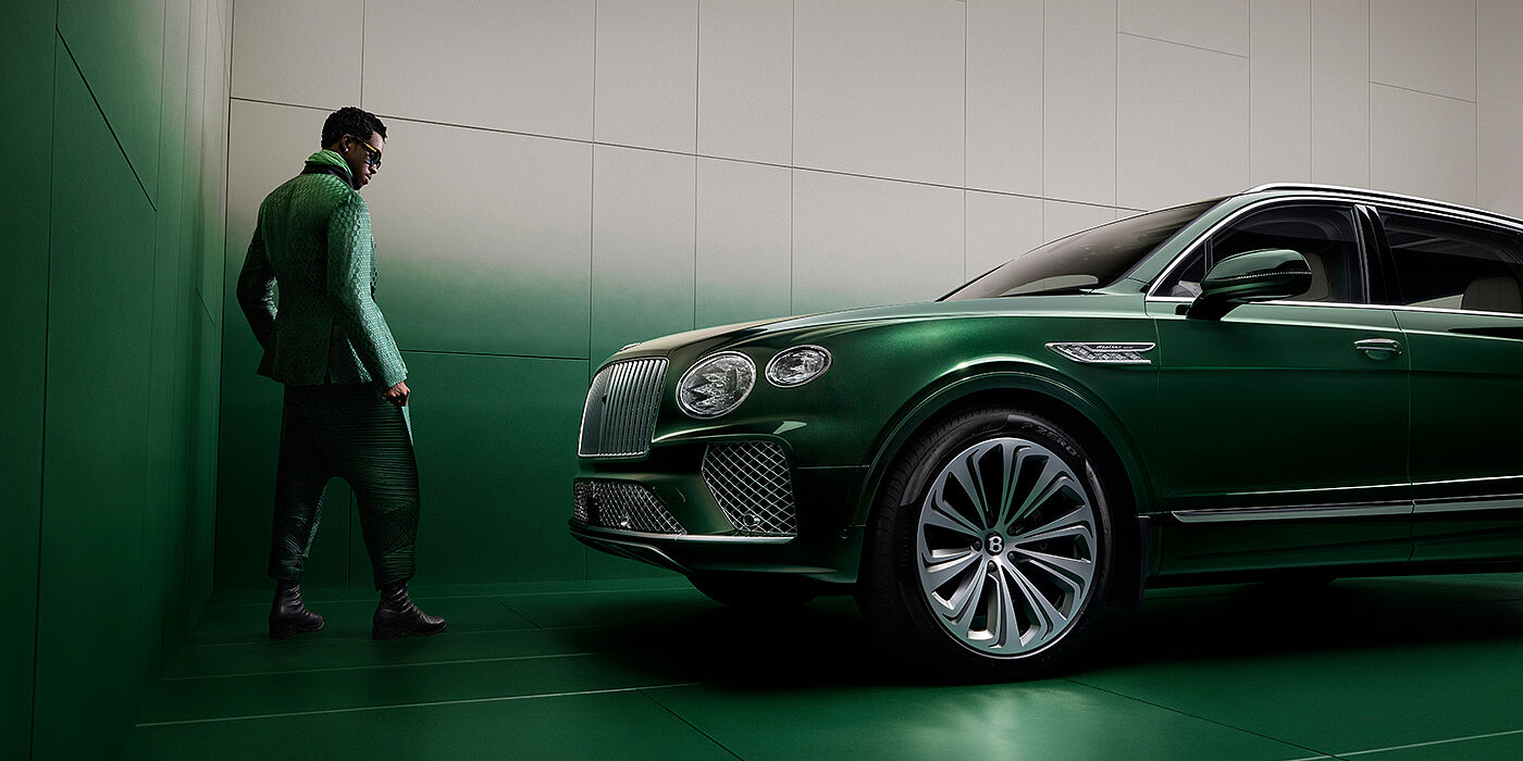 Bentley Bordeaux Wisdom K standing next to Bentley Bentayga Extended Wheelbase SUV in Light Emerald green paint in profile