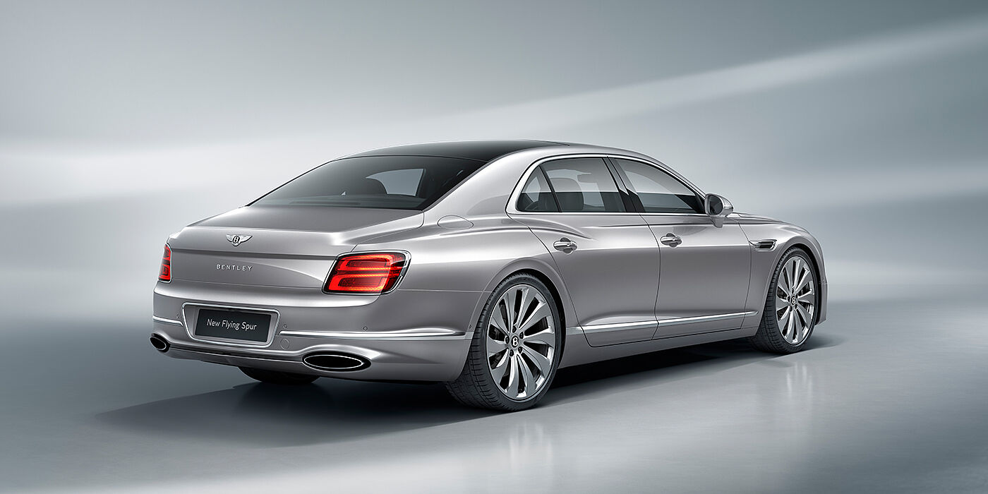 Bentley Bordeaux New Bentley Flying Spur sedan rear view in Silverlake paint with ten spoke wheels and chrome matrix grille