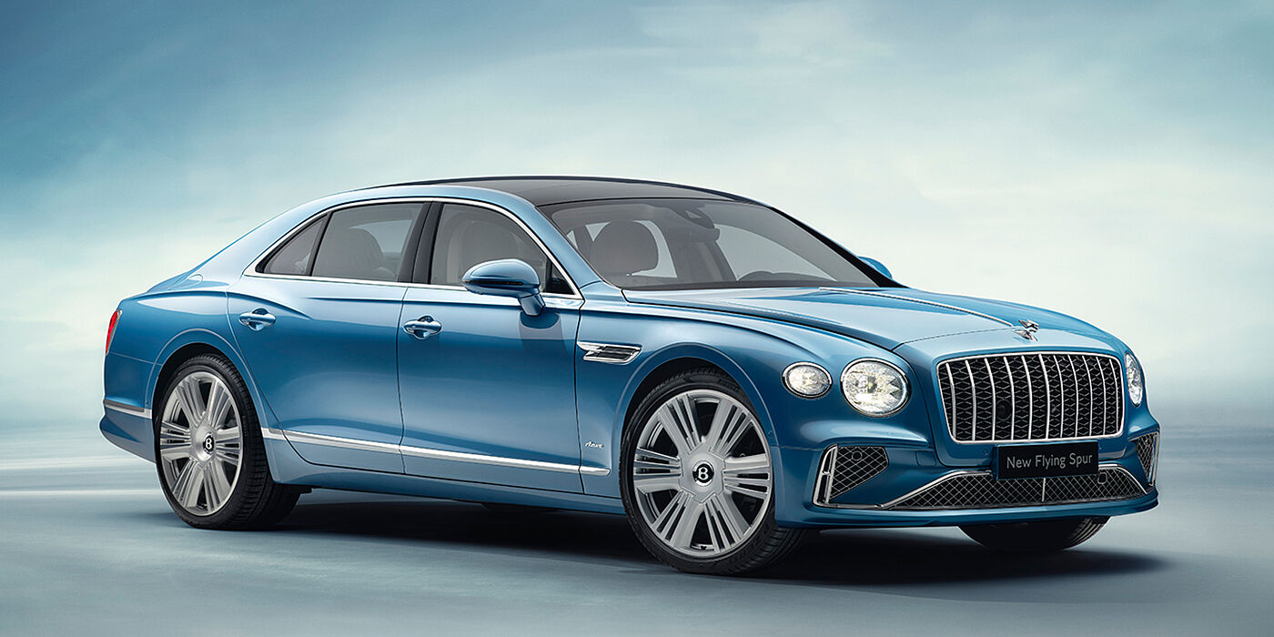Bentley Bordeaux New Bentley Flying Spur Azure sedan front view in Light windsor blue by Mulliner paint with 22 inch Azure wheels and chrome exterior details