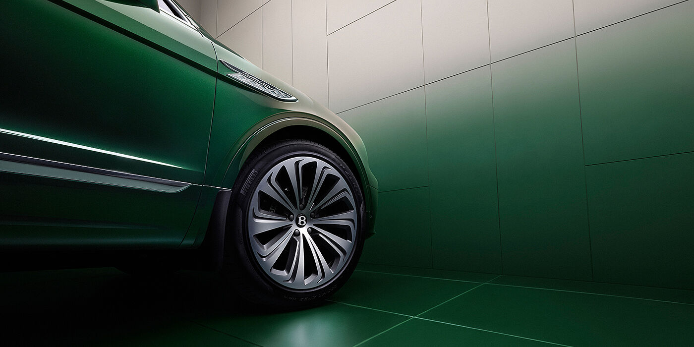 Bentley Bordeaux Bentley Bentayga Extended Wheelbase Atelier Edition SUV in Light Emerald green paint front side detail with 22 inch 10 spoke wheel
