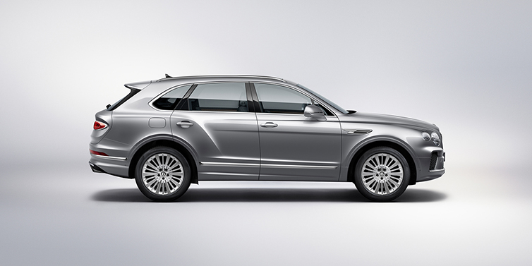 Bentley Bordeaux Bentley Bentayga SUV side profile in Moonbeam silver paint against white background featuring 21 inch 5 spoke wheels