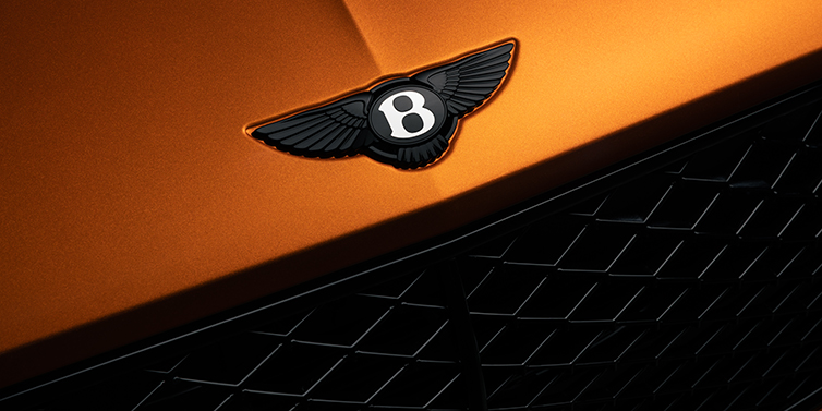 Bentley Bordeaux Bentley Continental GT coupe bonnet close up with black Bentley Wings bonnet badge