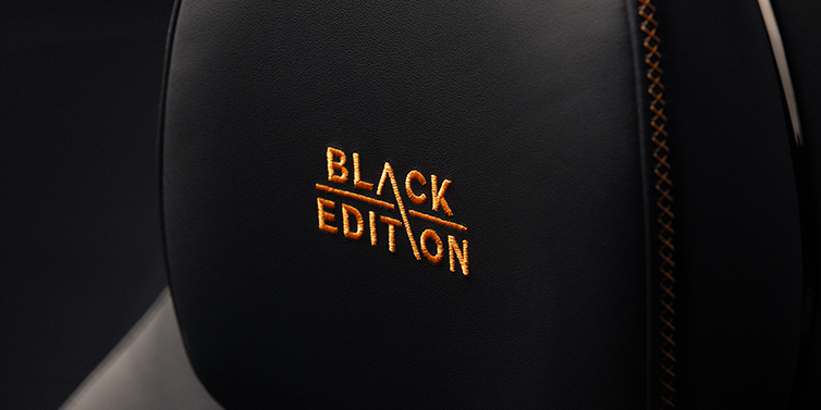 Bentley Bordeaux Bentley Continental GT coupe seat headrest Black Edition stitched emblem in Mandarin colour against Beluga black hide