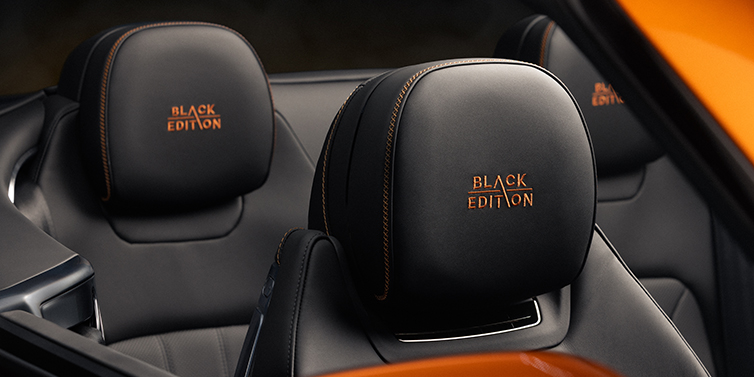 Bentley Bordeaux Bentley Continental GTC Black Edition convertible seat detail with Beluga black hide and Mandarin emblem stitching